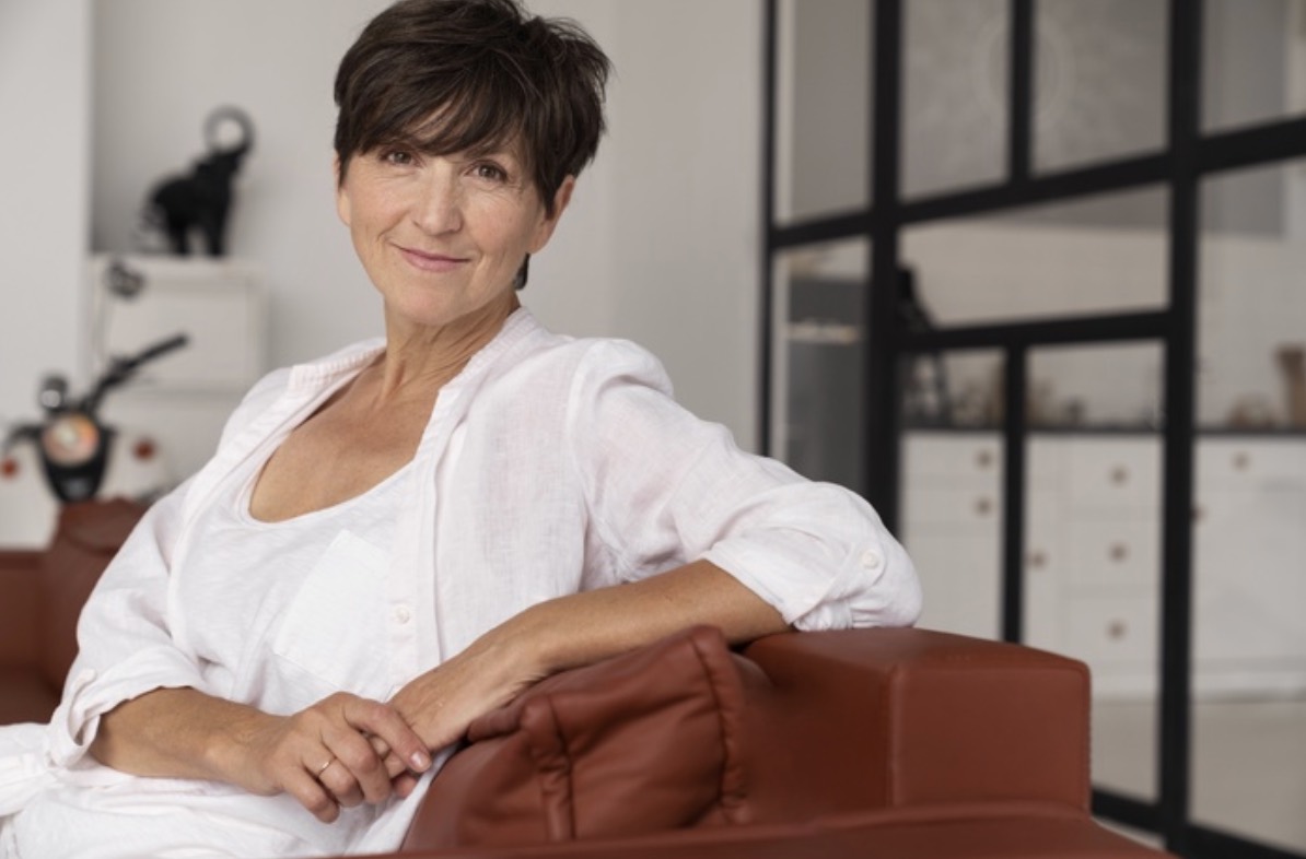 image of middle aged woman on sofa