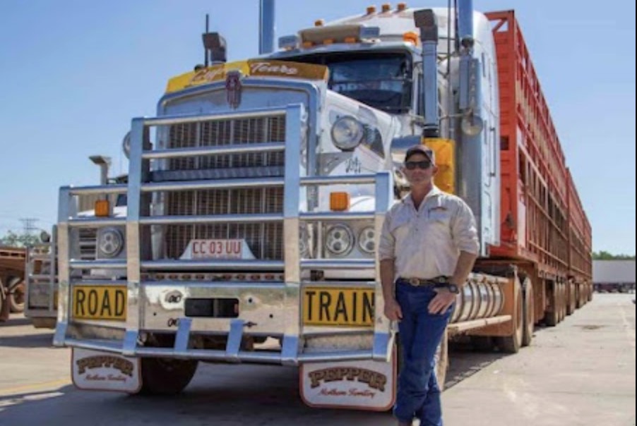 man outside his truck in outback australia
