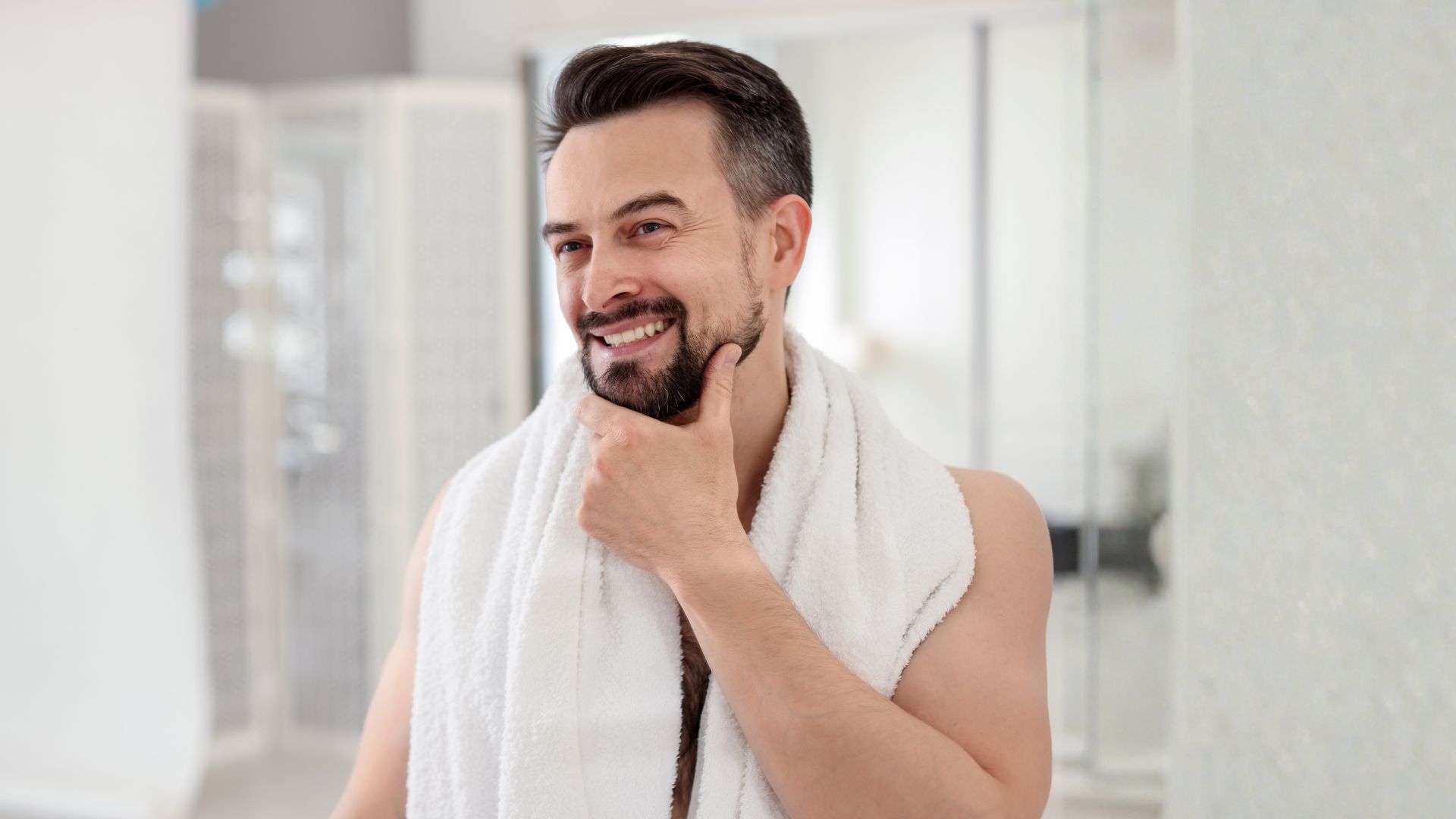 Confident man smiling after shower representing men’s health and confidence in Australia